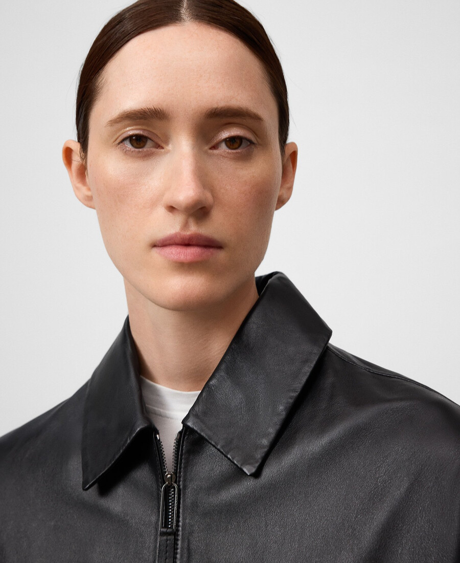 giacca in pelle con mantello posteriore donna